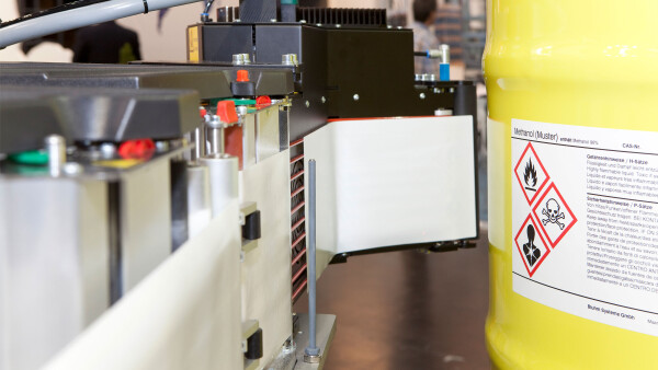 Industrial labelling of metal drums