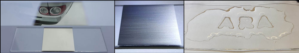 Aufgelaserte, spiegelnde Silberschicht (links), gebürstete Stahlschicht (Mitte) und transparente, super-hydrophobe und robuste Easy-to-Clean-Beschrift